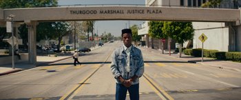 Movie still from “Dope” (2015), directed by Rick Famuyiwa – A man standing in the middle of the street; Wide shot, Low angle