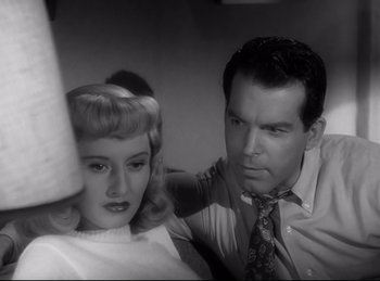 Movie still from “Double Indemnity” (1944), directed by Billy Wilder – A man and a woman are looking at each other; Close Up shot, High angle