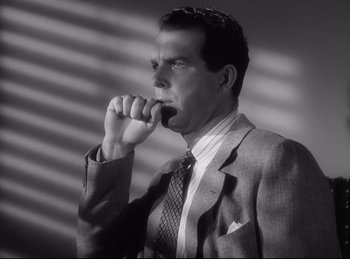 Movie still from “Double Indemnity” (1944), directed by Billy Wilder – A black and white photo of a man brushing his teeth; Close Up shot, Low angle