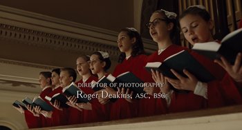 Movie still from “Doubt” (2008), directed by John Patrick Shanley – A group of young people singing in front of an audience; Medium shot, High angle