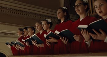 Movie still from “Doubt” (2008), directed by John Patrick Shanley – A group of young people holding books in their hands; Medium shot, Low angle
