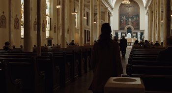 Movie still from “Doubt” (2008), directed by John Patrick Shanley – A woman is walking through a large church; Extreme Wide shot, High angle