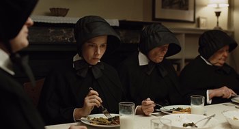 Movie still from “Doubt” (2008), directed by John Patrick Shanley – A couple of women sitting at a table eating food; Medium shot, High angle