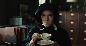 Movie still from “Doubt” (2008), directed by John Patrick Shanley – A person holding a tea cup in their hands; Close Up shot, Low angle