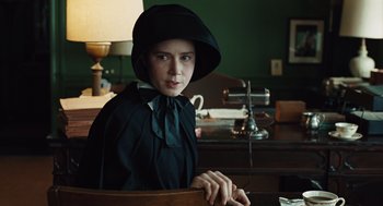 Movie still from “Doubt” (2008), directed by John Patrick Shanley – A woman in a black hat and a black dress; Medium shot, Over the shoulder angle