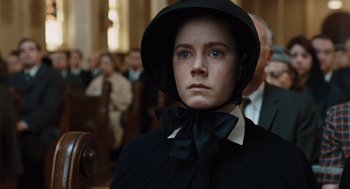 Movie still from “Doubt” (2008), directed by John Patrick Shanley – A woman wearing a black dress and a black hat; Close Up shot, Low angle
