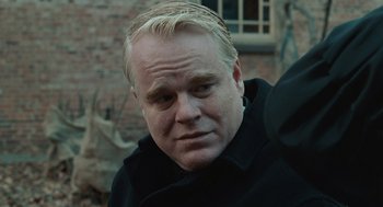Movie still from “Doubt” (2008), directed by John Patrick Shanley – A person wearing a black shirt; Close Up shot, Over the shoulder angle