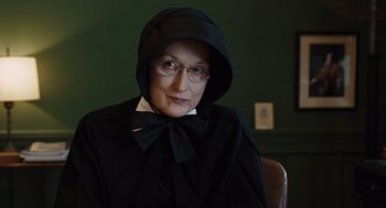 Movie still from “Doubt” (2008), directed by John Patrick Shanley – An older woman wearing a black hooded cape; Close Up shot, Low angle