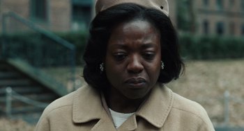 Movie still from “Doubt” (2008), directed by John Patrick Shanley – An older woman wearing a tan coat and a hat; Close Up shot, Low angle