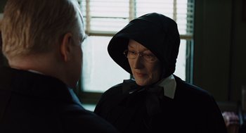 Movie still from “Doubt” (2008), directed by John Patrick Shanley – An older woman wearing a hood and glasses; Close Up shot, Over the shoulder angle