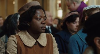 Movie still from “Doubt” (2008), directed by John Patrick Shanley – A woman in a brown coat and a brown hat; Close Up shot, Low angle