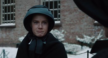 Movie still from “Doubt” (2008), directed by John Patrick Shanley – A woman wearing a black coat and a black hat; Close Up shot, Over the shoulder angle