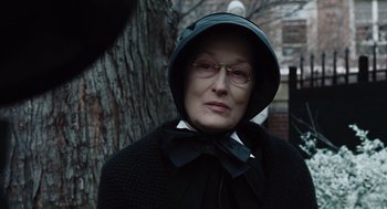 Movie still from “Doubt” (2008), directed by John Patrick Shanley – An older woman wearing a hat and glasses; Close Up shot, Over the shoulder angle
