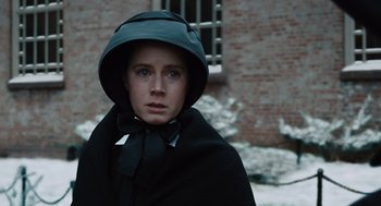 Movie still from “Doubt” (2008), directed by John Patrick Shanley – A person wearing a black coat and a black hat; Close Up shot, Low angle