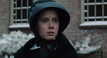 Movie still from “Doubt” (2008), directed by John Patrick Shanley – A woman wearing a black outfit and a black hat; Close Up shot, Low angle