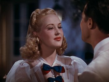 Movie still from “Down Argentine Way” (1940), directed by Irving Cummings – A man and a woman are talking to each other; Close Up shot, Over the shoulder angle