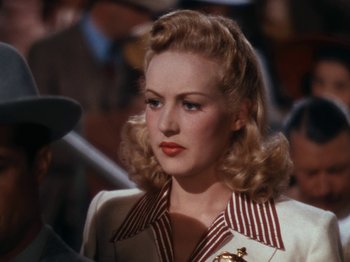 Movie still from “Down Argentine Way” (1940), directed by Irving Cummings – A person wearing a jacket; Close Up shot, Over the shoulder angle