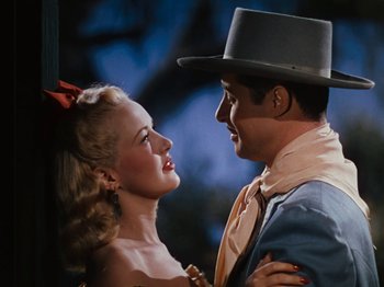 Movie still from “Down Argentine Way” (1940), directed by Irving Cummings – A man and a woman are looking at each other; Close Up shot, Low angle