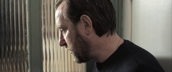 Movie still from “Down Terrace” (2009), directed by Ben Wheatley – A person with a beard; Close Up shot, Low angle