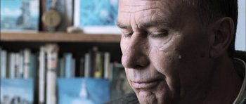 Movie still from “Down Terrace” (2009), directed by Ben Wheatley – An older man is looking down at his face; Close Up shot, Low angle