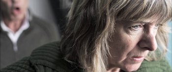Movie still from “Down Terrace” (2009), directed by Ben Wheatley – A woman's hair with long , messy ends; Extreme Close Up shot, Low angle