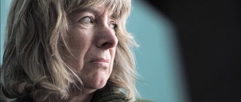 Movie still from “Down Terrace” (2009), directed by Ben Wheatley – An older woman with blonde hair looking to her left; Extreme Close Up shot, Low angle