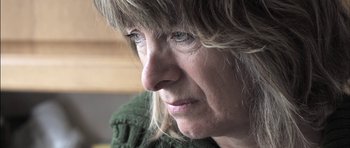 Movie still from “Down Terrace” (2009), directed by Ben Wheatley – A woman's face looking off into the distance; Close Up shot, High angle