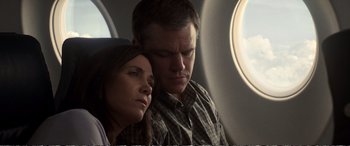 Movie still from “Downsizing” (2017), directed by Alexander Payne – A man and a woman sitting next to each other on a plane; Close Up shot, Overhead angle