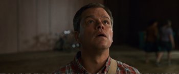 Movie still from “Downsizing” (2017), directed by Alexander Payne – A person looking up at the sky; Close Up shot, Low angle