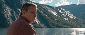 Movie still from “Downsizing” (2017), directed by Alexander Payne – A person near a body of water; Close Up shot, Low angle