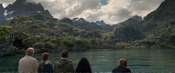Movie still from “Downsizing” (2017), directed by Alexander Payne – A group of people standing on top of a body of water; Extreme Wide shot, High angle