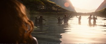 Movie still from “Downsizing” (2017), directed by Alexander Payne – A group of people swimming in a body of water; Extreme Wide shot, High angle