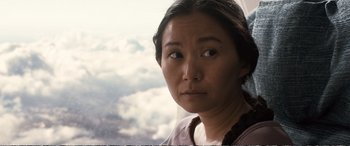 Movie still from “Downsizing” (2017), directed by Alexander Payne – A person looking at the camera; Close Up shot, Over the shoulder angle