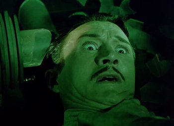 Movie still from “Dr. Cyclops” (1940), directed by Ernest B. Schoedsack – A man's face in green light; Close Up shot, Low angle