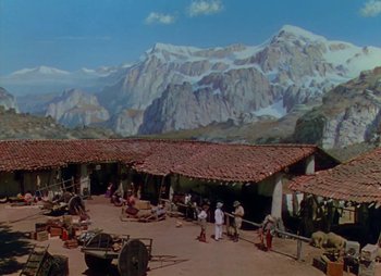 Movie still from “Dr. Cyclops” (1940), directed by Ernest B. Schoedsack – A group of people standing in front of a mountain; Extreme Wide shot, High angle