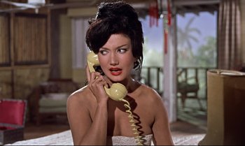 Movie still from “Dr. No” (1962), directed by Terence Young – A beautiful woman holding a phone to her ear; Close Up shot, High angle