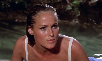 Movie still from “Dr. No” (1962), directed by Terence Young – A person with wet hair; Close Up shot, Low angle