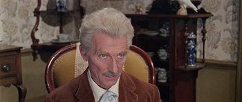 Movie still from “Dr. Who and the Daleks” (1965), directed by Gordon Flemyng – An older man with a mustache and a mustache comb; Close Up shot, High angle