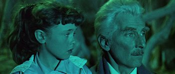 Movie still from “Dr. Who and the Daleks” (1965), directed by Gordon Flemyng – An older man and a young boy are looking at each other; Close Up shot, Over the shoulder angle