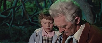 Movie still from “Dr. Who and the Daleks” (1965), directed by Gordon Flemyng – An older man and a young girl looking at each other; Close Up shot, Over the shoulder angle