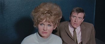 Movie still from “Dr. Who and the Daleks” (1965), directed by Gordon Flemyng – A man and a woman in a room with a blue wall in the background; Close Up shot, Low angle