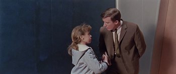 Movie still from “Dr. Who and the Daleks” (1965), directed by Gordon Flemyng – A man and a girl in a room; Medium shot, Over the shoulder angle