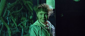 Movie still from “Dr. Who and the Daleks” (1965), directed by Gordon Flemyng – A young boy with a messy hair style; Close Up shot, Over the shoulder angle