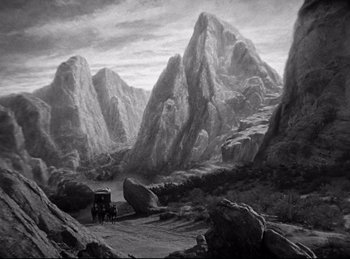 Movie still from “Dracula” (1931), directed by Tod Browning – A black and white painting of a car on a dirt road in the mountains; Extreme Wide shot, High angle
