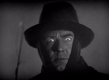 Movie still from “Dracula” (1931), directed by Tod Browning – A black and white photo of a man with a hat; Close Up shot, Low angle