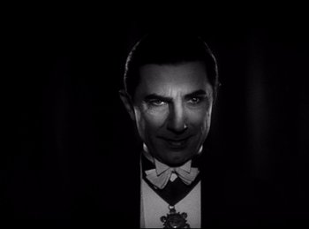 Movie still from “Dracula” (1931), directed by Tod Browning – A black and white photo of a man in a suit; Close Up shot, Low angle
