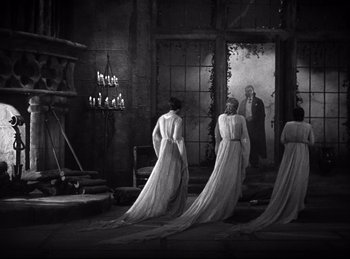 Movie still from “Dracula” (1931), directed by Tod Browning – A group of women standing next to each other in white dresses; Wide shot, Over the shoulder angle