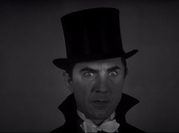 Movie still from “Dracula” (1931), directed by Tod Browning – A person wearing a top hat; Close Up shot, Low angle