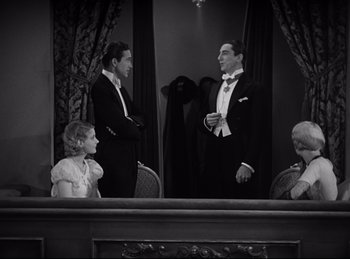 Movie still from “Dracula” (1931), directed by Tod Browning – Two men and a little girl in formal wear; Medium shot, High angle