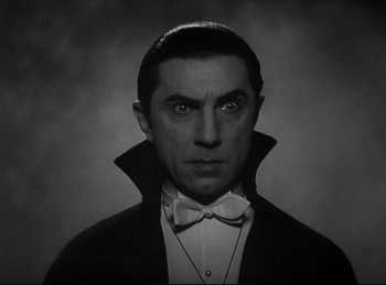 Movie still from “Dracula” (1931), directed by Tod Browning – A black and white photo of a man dressed as dracula; Close Up shot, Low angle